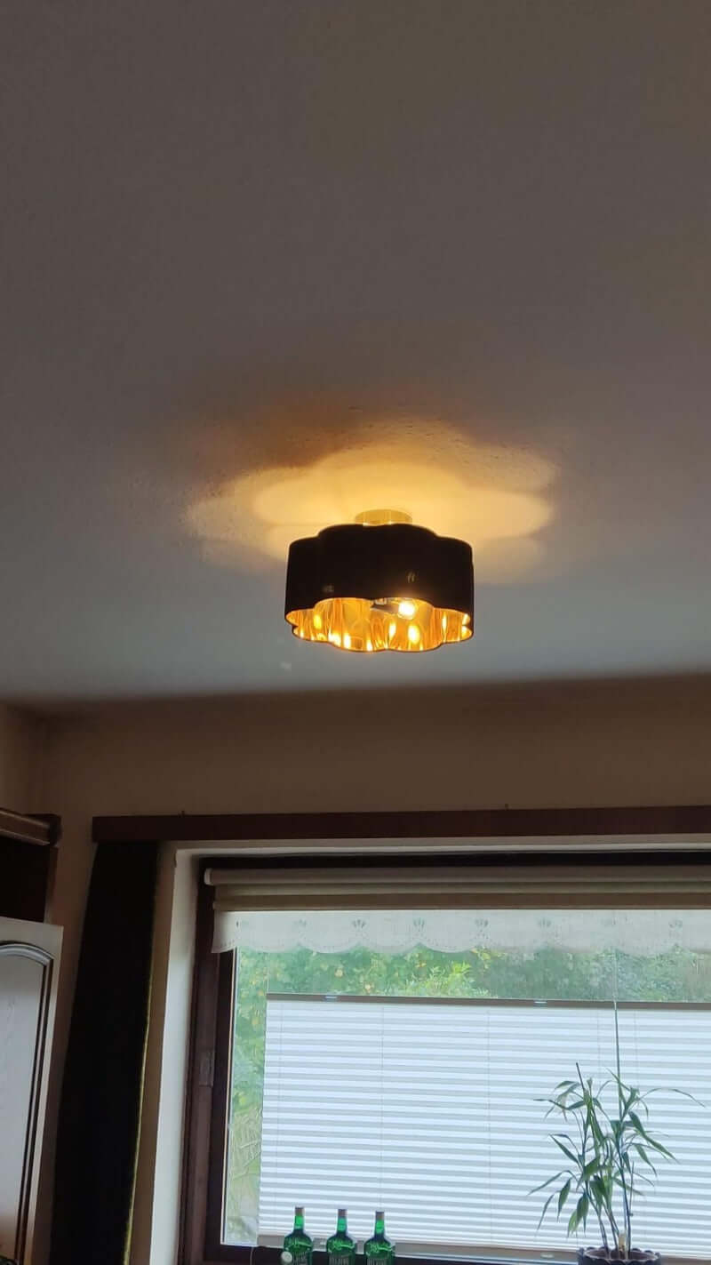 3-Lights Black Fabric Shade Semi Flush Mount Ceiling Light Fixture illuminating a room with a stylish design.