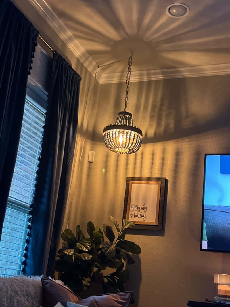 Wood Bead Chandelier Pendant antique Blue Finishing,Plug in hanging in a cozy living room.
