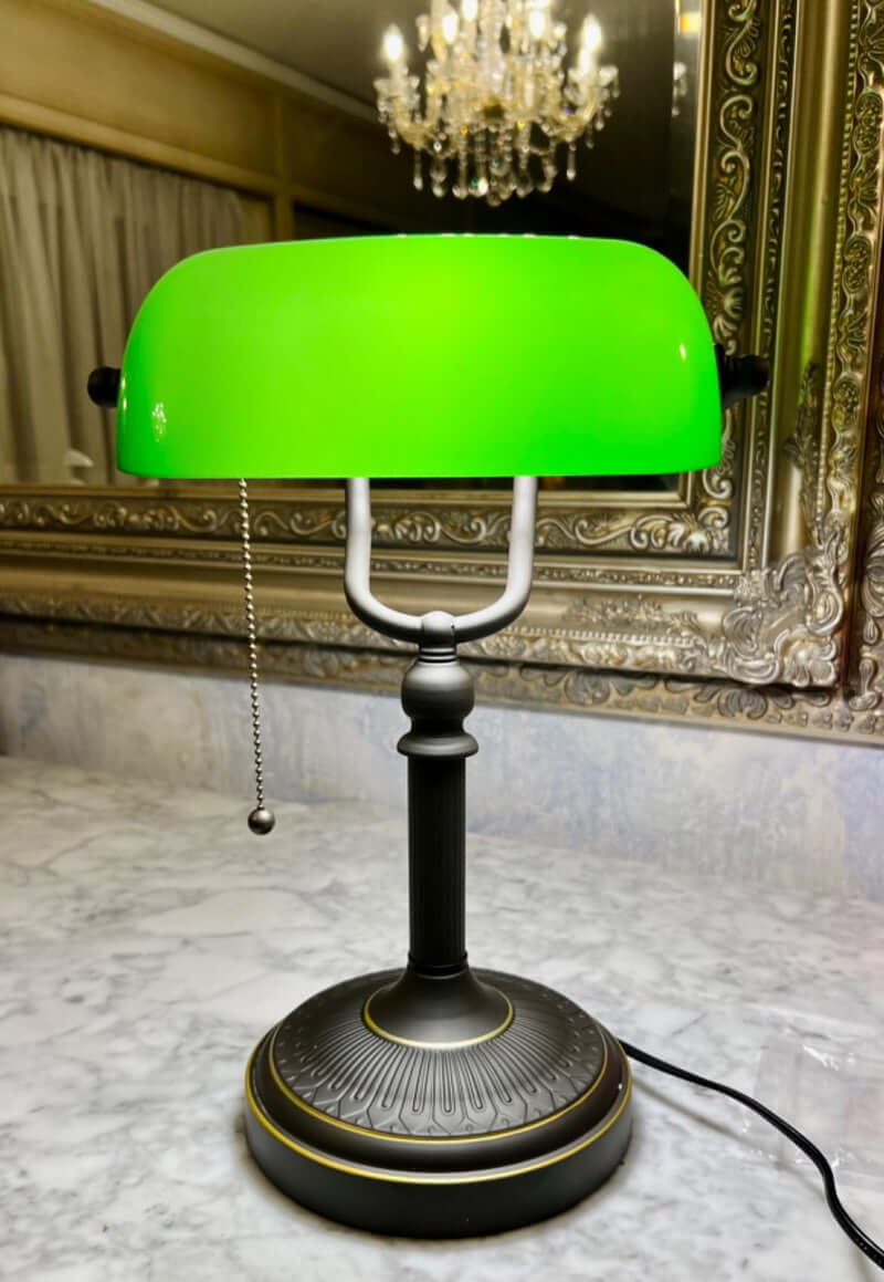 Antique Green Glass Desk Lamp with Pull Chain Switch,Banker Lamp on a marble surface.