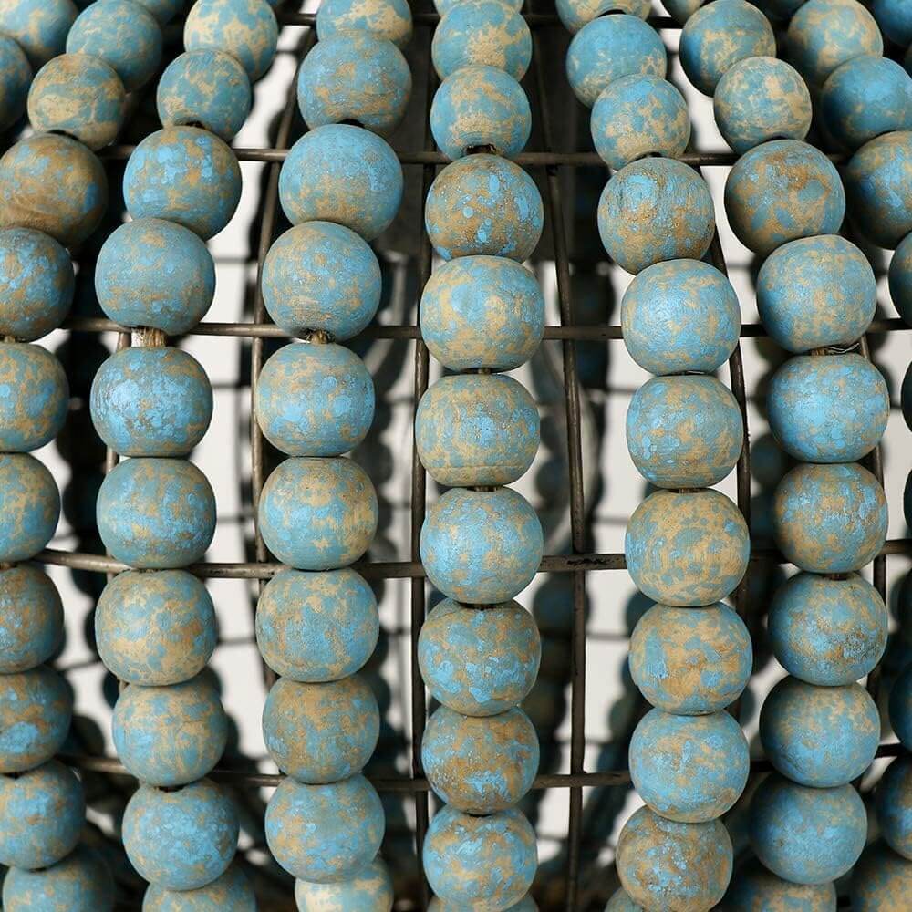 Close-up of Blue Wood Bead Globe Pendant Light showcasing intricate blue and tan beads.