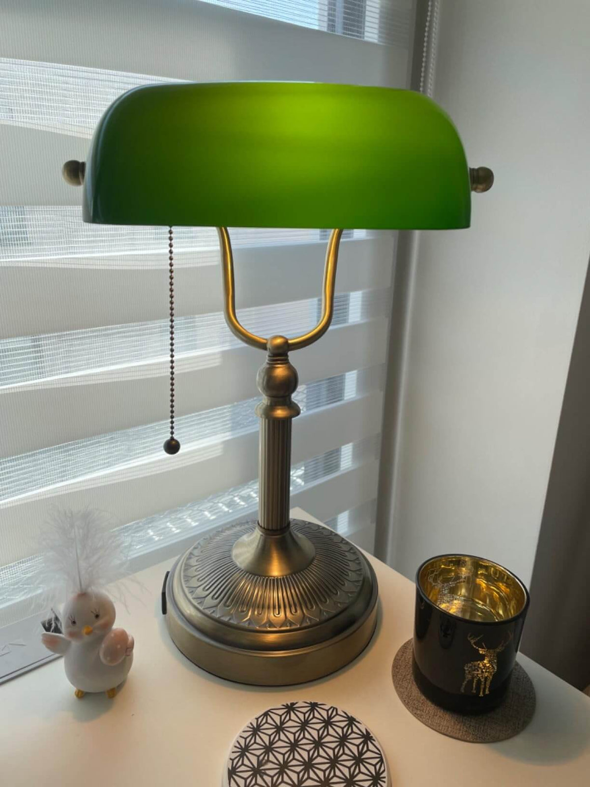 Newrays Green Glass Banker Lamp with adjustable point and elegant design on a modern desk.