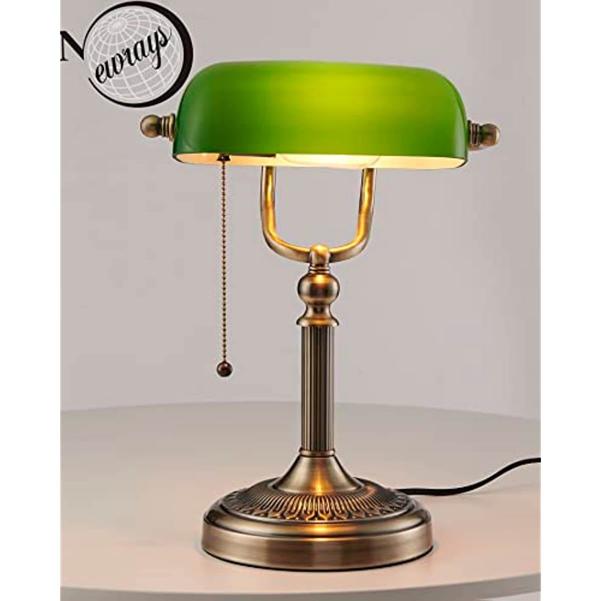 Newrays Green Glass Banker Lamp showcasing its elegant design and adjustable fixture on a stylish table.