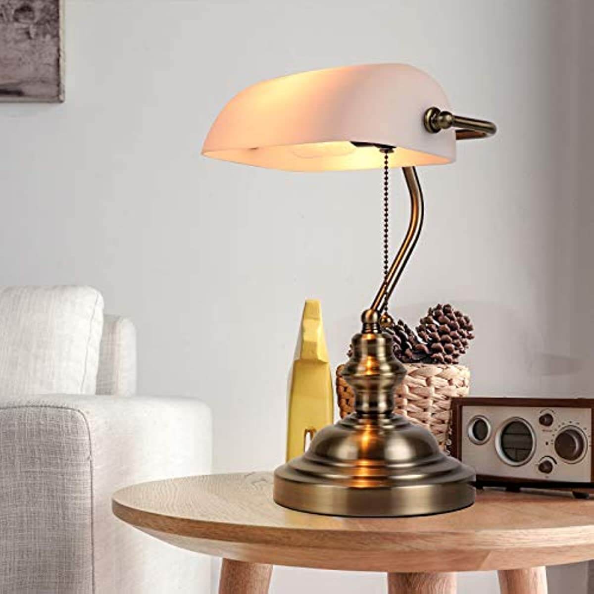White Matted Glass Banker Lamp on a wooden table, providing eye-caring light for reading.