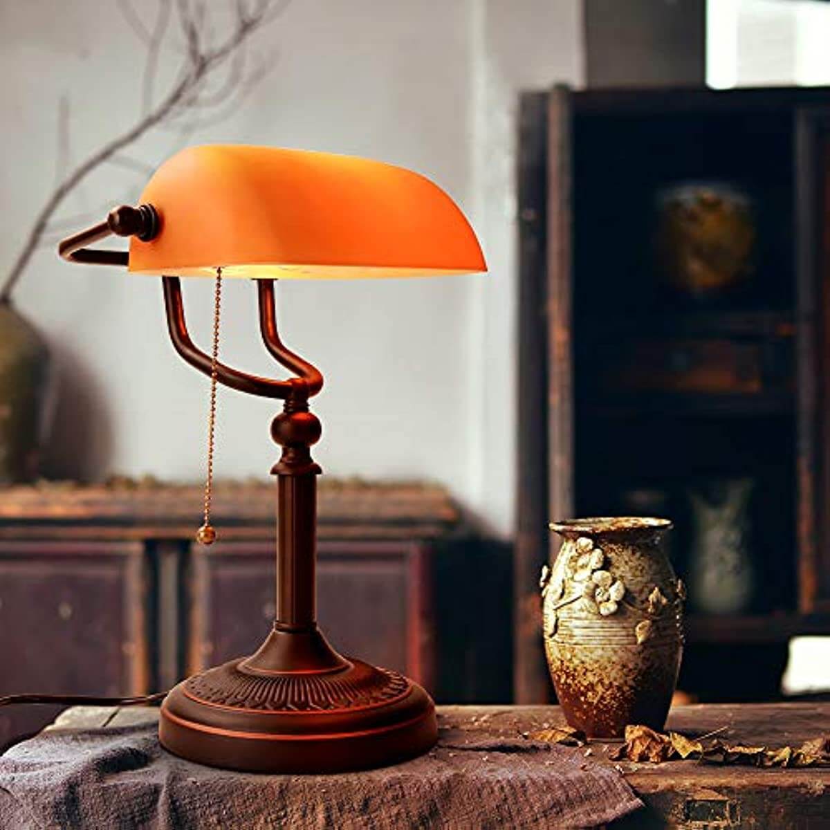 Newrays Matted Orange Glass Banker Desk Lamp with a stylish design and orange shade, perfect for enhancing home decor.