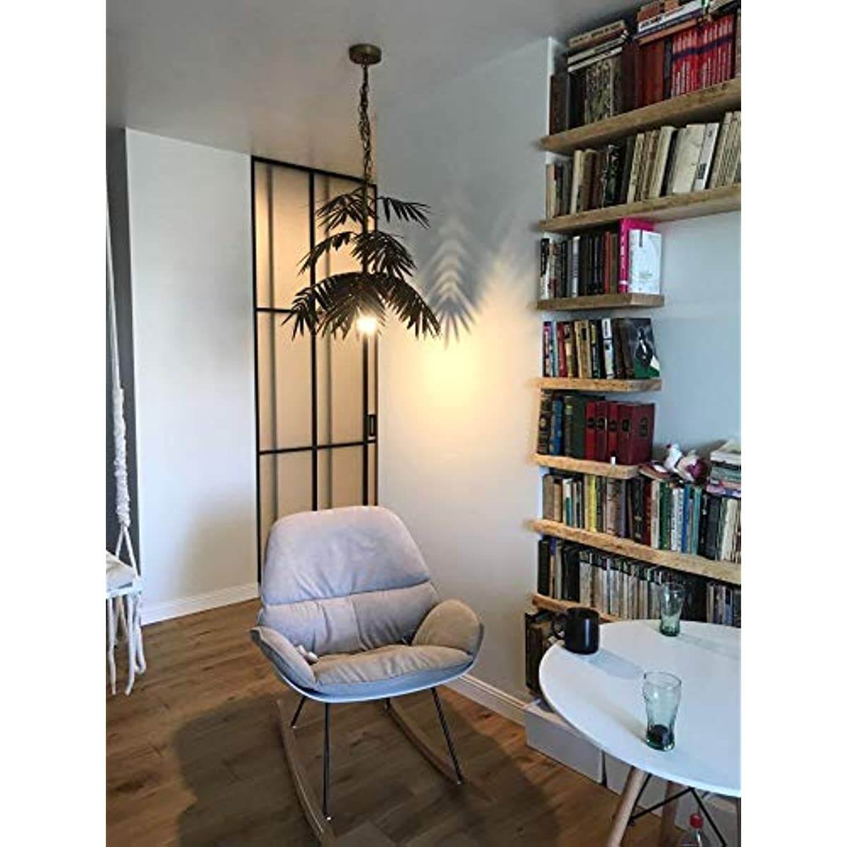 Adjustable Tropical Coconut Leaves Chandelier Unique Rustic Tree Lamps illuminating a cozy living space with books