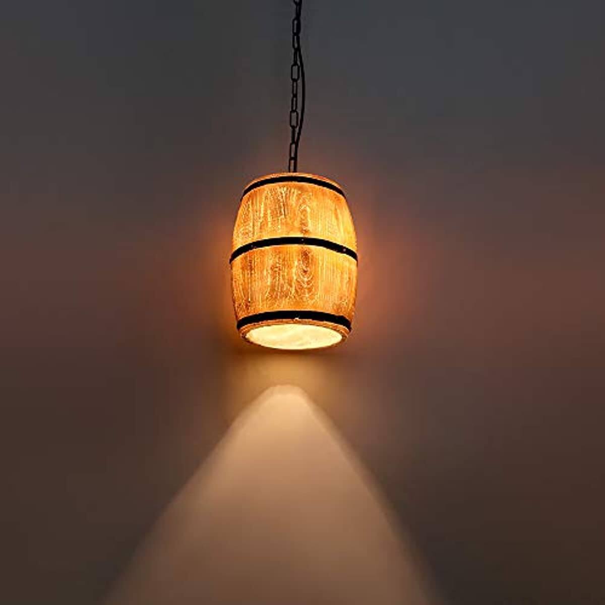 Newrays Antique Artificial Resin Wine Barrel Pendant Lamp illuminating a wall with warm light.