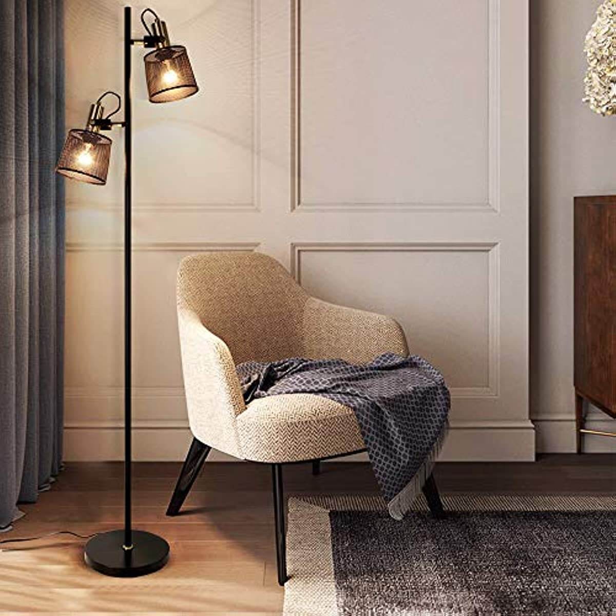 Newrays Industrial Iron Floor Lamps with Adjustable Shade near a cozy armchair in a stylish living room.