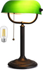 Antique green glass bankers desk lamp with a bronze base and a stylish green shade for a classic look.