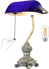 Retro blue glass desk lamp with an ornate base and pull chain switch, perfect for vintage decor.