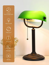 Antique green glass bankers desk lamp with a quick-change shade and pull switch features.