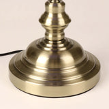 Base of a Blue Glass Banker Desk Lamp with Pull Chain Switch showing brushed metal finish and power cord.