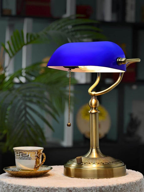 Newrays Blue Glass Desk Lamp, Stepless Dimmable Bankers Desk Lamp on a table with a decorative cup.