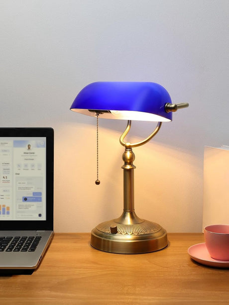 Newrays Blue Glass Desk Lamp, Stepless Dimmable Bankers Desk Lamp on a wooden desk with a laptop and cup.