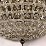 Close-up view of vintage royal empire crystal wall sconces showcasing intricate metalwork and sparkling crystal accents.