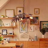 Tropical Coconut Leaves Chandelier ,Tree Lights providing vintage decor in a cozy living space with art and plants.