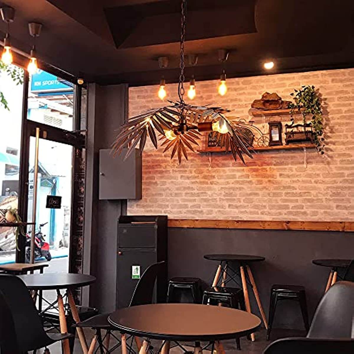 Tropical Coconut Leaves Chandelier ,Tree Lights illuminating a cafe interior with stylish vintage decor and warm lighting.