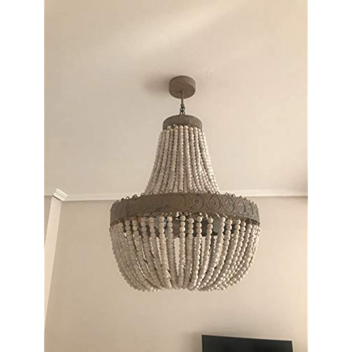 Wood Bead Chandelier Pendant Three Lights Gray White Finishing hanging from the ceiling in a modern room.